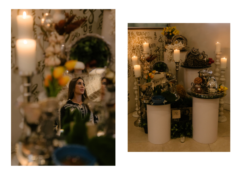 A diptych: On the left a photo of an Iranian woman with long dark hair and a silky patterned blouse. Her image reflected in a mirror on an altar with candles and flowers. On the right there's an altar with multiple white candles on a metal stands, and cylindrical stands with round tops where various objects like flowers, water bowls, and metal dishes sit.