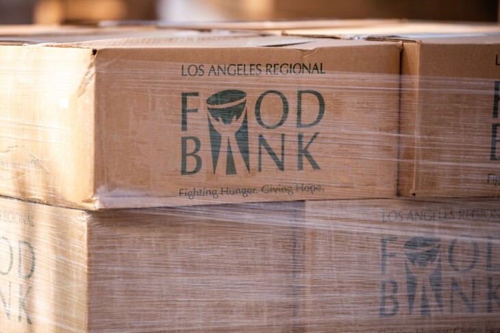 A photograph of several boxes that are branded with the name and logo of the Los Angeles Regional Food Bank.