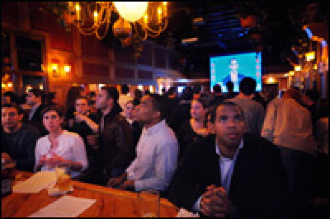Patrons watch the first presidential debate at a bar called Top of The Hill in Washington, D.C., Sept. 26, 2008.