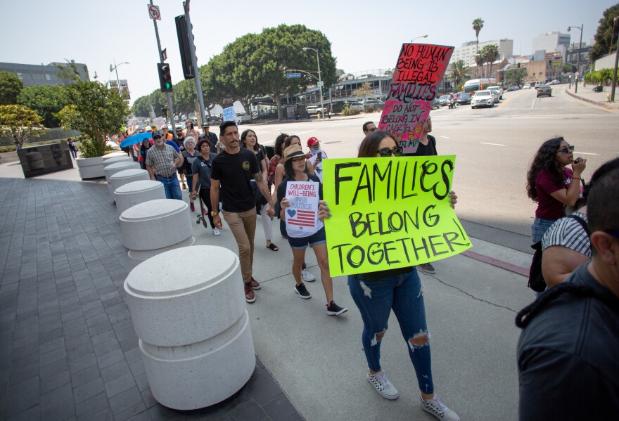 Protesters circle the Immigration and Customs Enforcement processing center in protest to the Trump administrations family separations related to the zero-tolerance policy along the border, in Los Angeles, California, June 21, 2018.