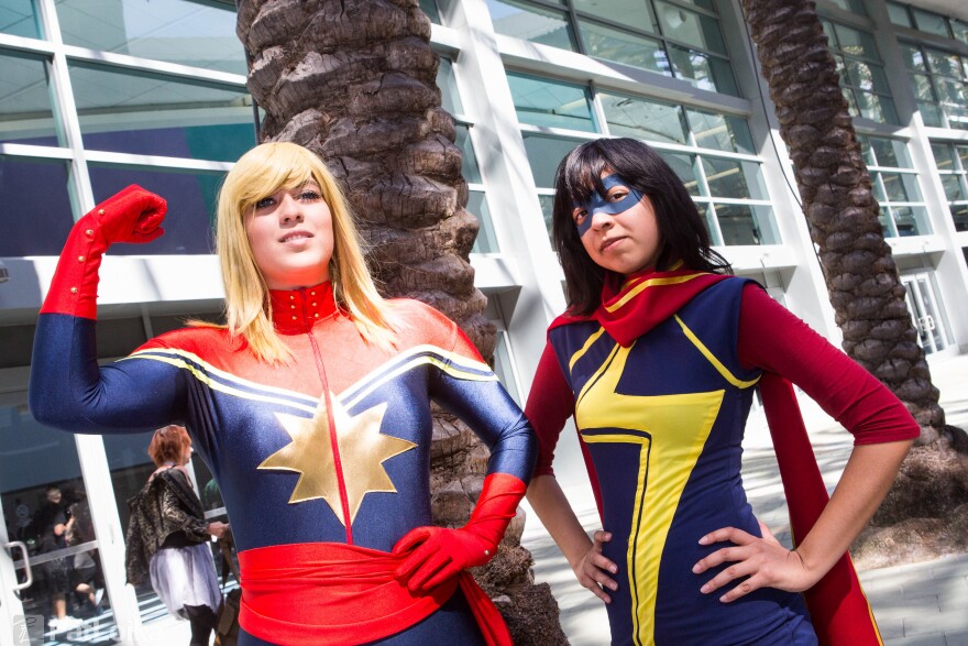 Fans cosplaying as Captain Marvel and Ms. Marvel at WonderCon Anaheim 2015.