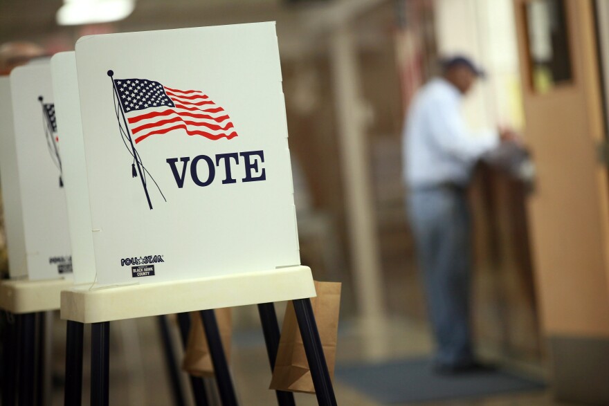 WATERLOO, IA - SEPTEMBER 27: Voting booths are set up for early voting at the Black Hawk County Courthouse on September 27, 2012 in Waterloo, Iowa. Early voting starts today in Iowa where in the 2008 election 36 percent of voters cast an early ballot.  (Photo by Scott Olson/Getty Images)