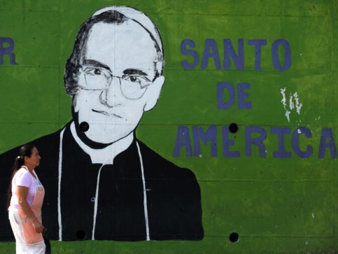 A woman passes by a mural depicting the portrait of Mons. Oscar Arnulfo Romero at La Divina Providencia Hospital in San Salvador on March 17, 2010, ahead of the commemoration of the 30th anniversary of his murder next March 24th. 