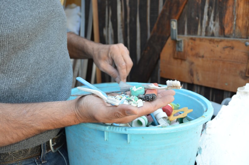 Eriksen keeps bins of various plastics he's collected during his travels.