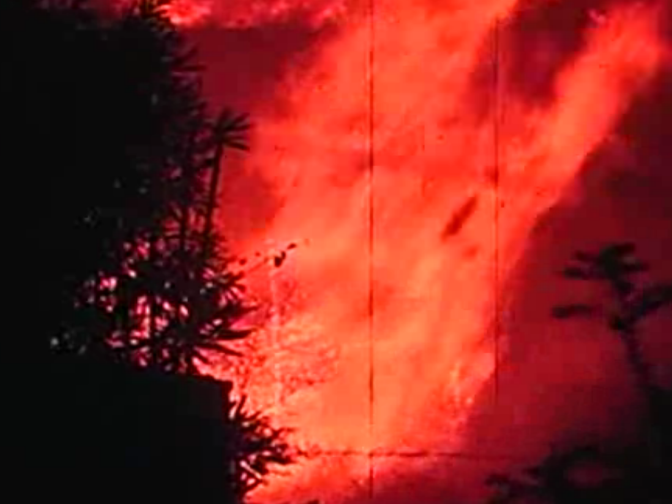 A fire roars in this scene from 'Design for Disaster.'