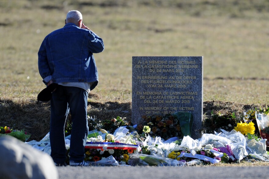 A man stands on March 29 2015 in front of a commemorative headstone in Seyne-les-Alpes, the closest accessible site to where a Germanwings Airbus A320 crashed on March 24 in the French Alps, killing all 150 people on board.
                                AFP PHOTO / JEAN-PERRE CLATOT        (Photo credit should read JEAN-PIERRE CLATOT/AFP/Getty Images)