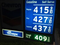 The Labor Department reported Tuesday that a jump in gasoline costs pushed a measure of U.S. consumer prices up in June. But the overall trend in inflation stayed tame. (Photo: Gasoline prices at a Newport Beach, Calif. Chevron station on July 16, 2013)