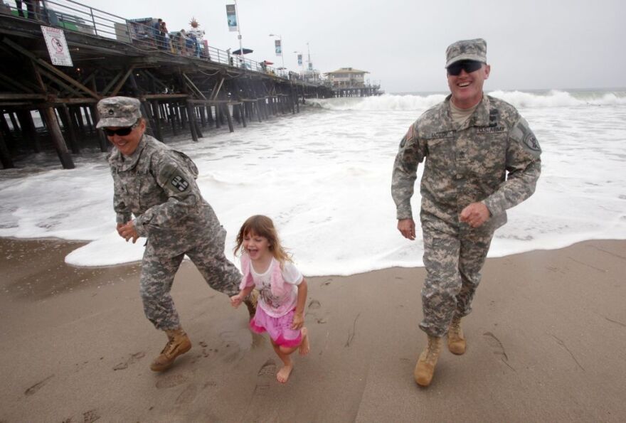 First Sergeant Tim McCoy, wife Amy, and daughter Sami in Santa Monica. This shoot was for HeartsAprart.org.  