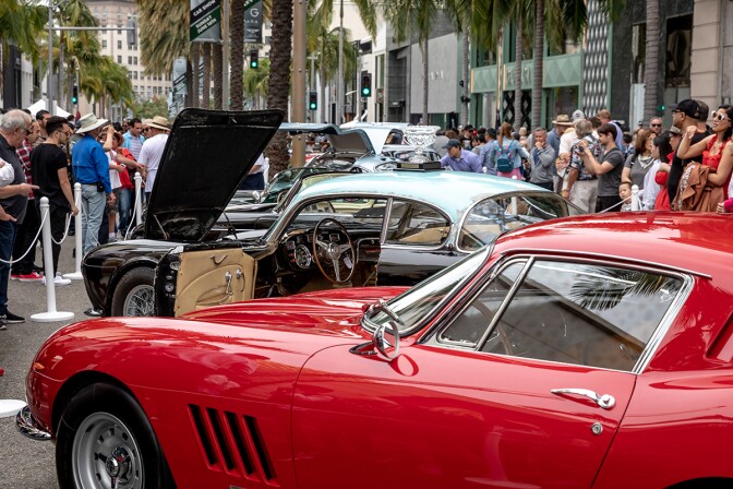 Classic cars are displayed on Rodeo Drive for crowds to examine.