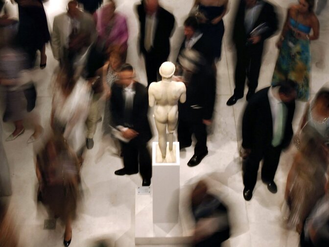 Officials and dignitaries tour the museum at its official opening in June. Greek officials say the museum should also display multiple sculptures that were first removed from the Parthenon frieze 200 years ago by Lord Elgin and later sold to the British Museum. 