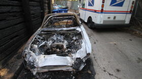 One of the burned cars outside Jim Morrison's former residence on the 8000 block of Rothdell Trail.