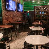 COLUMBUS, OH - SUNDAY, MARCH 15: Waiters and bartenders clean up bars and restaurants along North High Street in the Short North District on March 15, 2020 in Columbus, Ohio. Ohio Governor Mike DeWine announced the government would issue an order closing all bars and restaurants in Ohio beginning at 9 pm Sunday due to the ongoing threat of the coronavirus (COVID-19) outbreak.  (Photo by Matthew Hatcher/Getty Images)