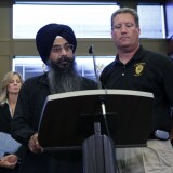 OAK CREEK, MI - AUGUST 6:  Oak Creek Police Chief John Edwards (R) along with a member of the Sikh Church names victims of the shooting at the Sikh Temple of Wisconsin where yesterday a gunman fired upon people at service, at a press conference, August, 6, 2012 in Oak Creek, Wisconsin. At least six people were killed when the shooter identified as Wade Michael Page opened fire on congregants in the Milwaukee suburb. The suspect who was a United States Army veteran was shot dead in a shootout with  police.  (Photo by Darren Hauck/Getty Images)
