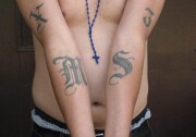 This handout photo provided by US Immigration and Customs Enforcement, taken June 23, 2008 in Washington, shows an example of a tattoo of the gang Mara Salvatrucha (MS-13). The Obama administration has labeled a violent Central American street gang as an international criminal organization subject to U.S. government sanctions, the first time this designation has been given to such a group.  (AP Photo/Michael Johnson, ICE)