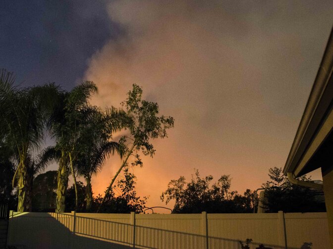 Smoke rising above Corona as seen from the backyard of KPCC listener Austin Drissen, near Auburndale and River, on Sunday, April 19, 2015. The Highway Fire has burned more than 1,000 acres and temporarily threatened some 200 homes.