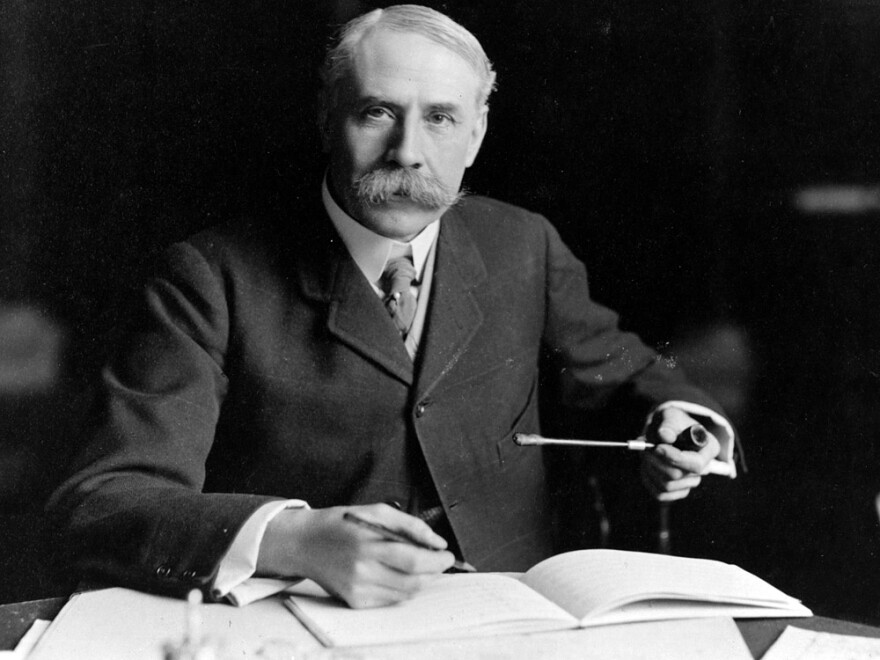 British composer Edward Elgar, seated at his desk at Severn House in Hampstead. His Symphony No. 1 was hailed as the best British symphony ever when it debuted in 1908.
