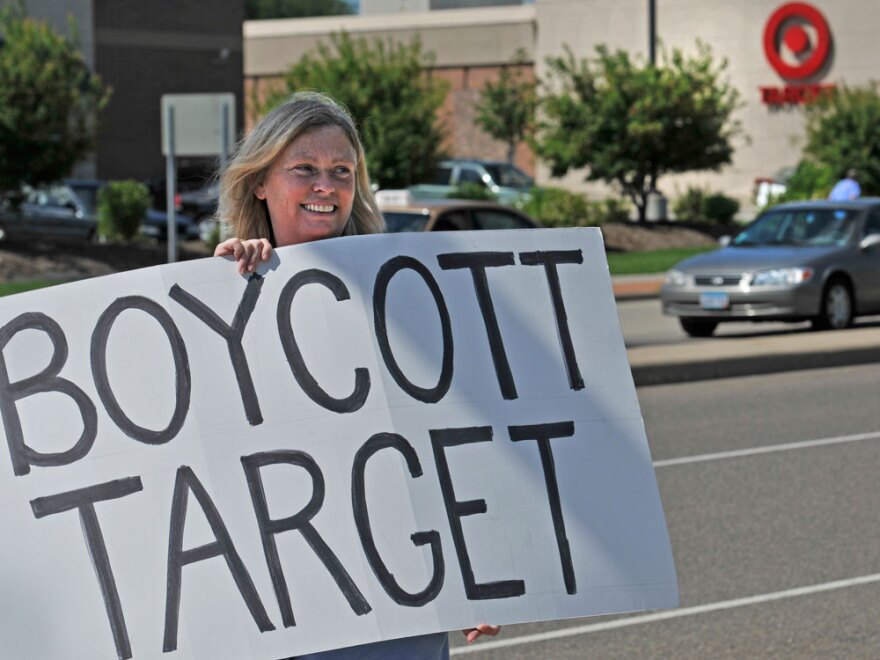 Laura Hedlund, 48, protests in front of a Minnesota Target store after the company made a donation that was used for an ad supporting Republican Tom Emmer's bid to be governor of Minnesota.