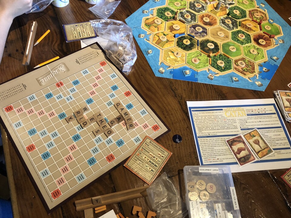 After finishing Monopoly, Yeon Kim, Mark Yang, and their friends moved on to Catan, but their secondary game Scrabble is still going strong