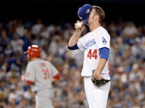 Pitcher Chris Withrow #44 of the Los Angeles Dodgers reacts after he is called for a balk in the fifth inning against the St. Louis Cardinals in Game Four of the National League Championship Series at Dodger Stadium on October 15, 2013 in Los Angeles, California.
