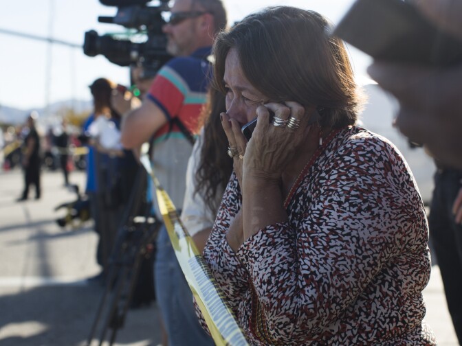 Olivia Navarro, 63, waits to hear the status of her daughter, Jamil Navarro, who works in the Inland Regional Center in San Bernardino where a mass shooting took place on Wednesday, Dec. 2, 2015.