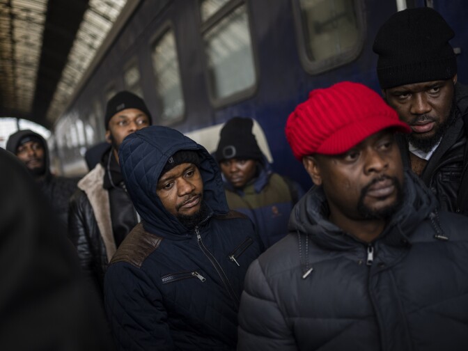 African residents in Ukraine wait at the platform inside the Lviv railway station on Sunday in Lviv in western Ukraine.