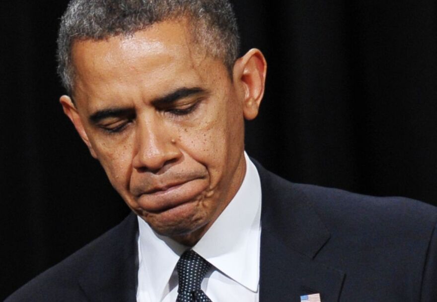 US President Barack Obama pauses as he speaks during a memorial service for the victims and relatives of the Sandy Hook Elementary School shooting on December 16, 2012 in Newtown, Connecticut. Twenty-six people were killed when a gunman entered Sandy Hook Elementary and began a shooting spree.