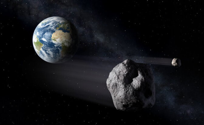 An artist's rendering of an asteroid flying be close to Earth.