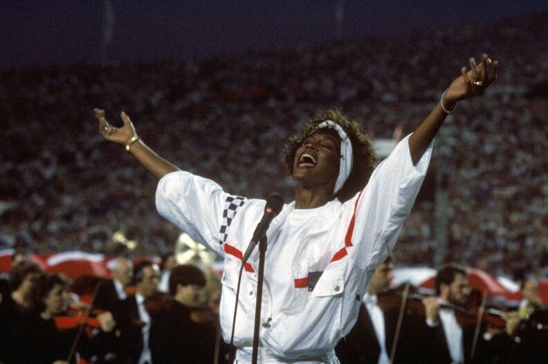 Whitney Houston sings the National Anthem before a game with the New York Giants taking on the Buffalo Bills prior to Super Bowl XXV at Tampa Stadium on January 27, 1991 in Tampa, Florida. The Giants won 20-19.