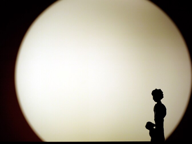 The trinket of the hero of the novel " The Little Prince " of Antoine de Saint-Exupery stands on the toy shop window near the light of the lamp in capital Ankara.