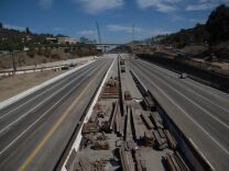A mile-long stretch of the I-405 freeway in West L.A. will be closed overnight this weekend from Saturday to Monday. (Photo: The empty 405 Freeway as a major construction project started in 2012)