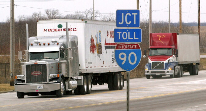  Tractor-trailers move along an interstate frontage road in January 2004 in Hampshire, Illinois. The U.S. Department of Transportation introduced new rules that include an increase in the amount of rest truck drivers must take between shifts, and an increase in the allowable number of driving hours per shift