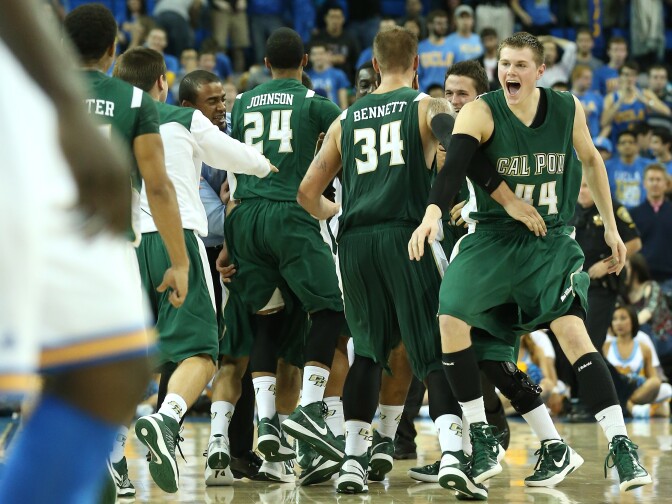 LOS ANGELES, CA - NOVEMBER 25:  Gordan Zach #44 and Brian Bennett #34 of the Cal Poly Mustangs celebrate with their team after the game against the UCLA Bruins at Pauley Pavilion on November 25, 2012 in Los Angeles, California.  Cal Poly won 70-68.  (Photo by Stephen Dunn/Getty Images)