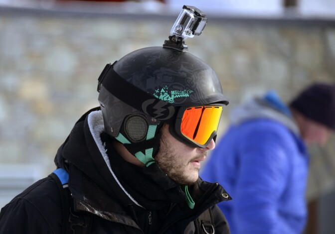 A skier carrying a GoPro camera on his helmet is seen on November 24, 2013 at Val Thorens, in the French Alps, during the ski station's opening week-end. Val Thorens is Europe's highest ski station (2300 m) and has opened three slopes two days in advance due to recent snow falls. 