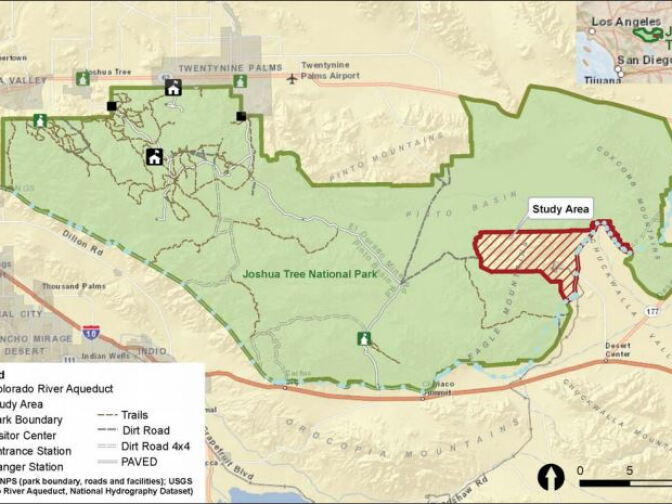The map shows the current boundaries of Joshua Tree National Park in green and a swath of land that may be transferred to the park from the Bureau of Land Management in red.