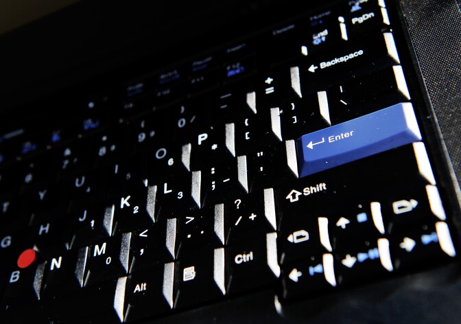 A computer keyboard is displayed in Sydney on July 9, 2012. Tens of thousands of people around the world whose computers were infected with malware known as DNS Changer last year, may lose their Internet access on July 9 when a US government fix expires, security experts say. The largest number of computers were in the United States (69,000), but more than a dozen countries including Australia, were also believed to have infected computers. AFP PHOTO / Greg WOOD (Photo credit should read GREG WOOD/AFP/Getty Images)
