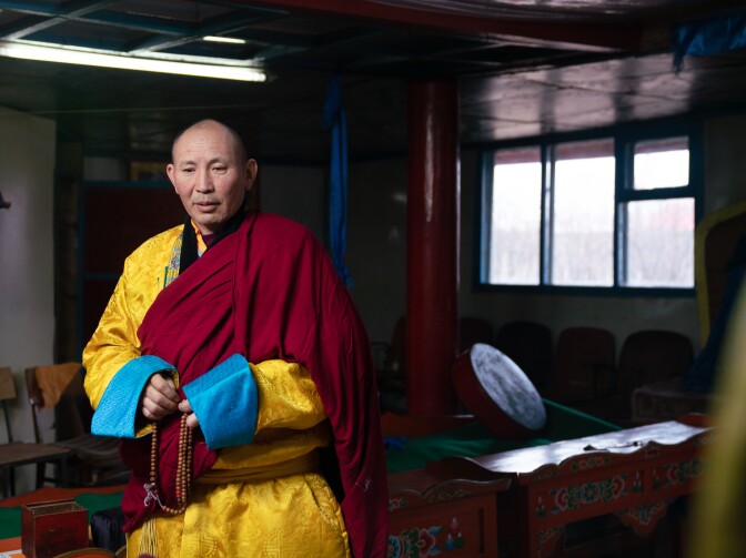 Buddhist monk Banzragch Purevsuren comforted herders affected by the 2009-2010 <em>dzud</em> by reading from Buddhist texts. He joined government officials in making home visits. "Herders are hardworking," he says. "They can survive."
