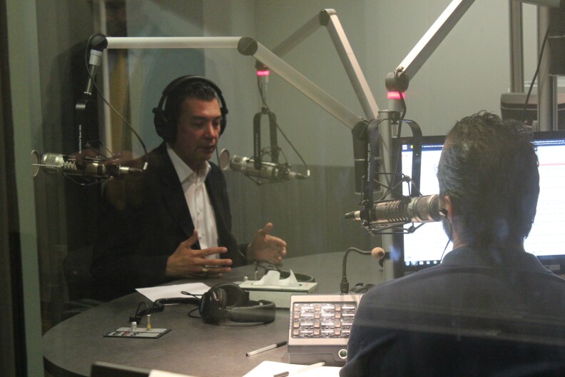 California Secretary of State Alex Padilla talks to A. Martinez. 