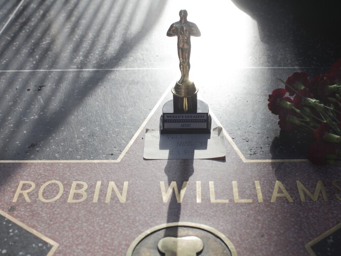 Items are left in memory of Robin Williams on his star along Hollywood Boulevard.