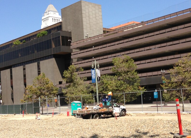 Workers at the site of the new Civic Center Park near 2nd and Broadway in downtown Los Angeles.