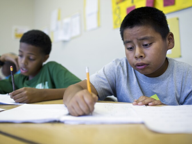Eleven-year-old David Leon, right, attends the fourth week of a pre-algebra class at the West Angeles Church Youth Center on Thursday afternoon, July 30, 2015. The Summer Algebra Institute program aims to bring more students of color up to speed on math as part of ongoing efforts to improve their college entry rates.