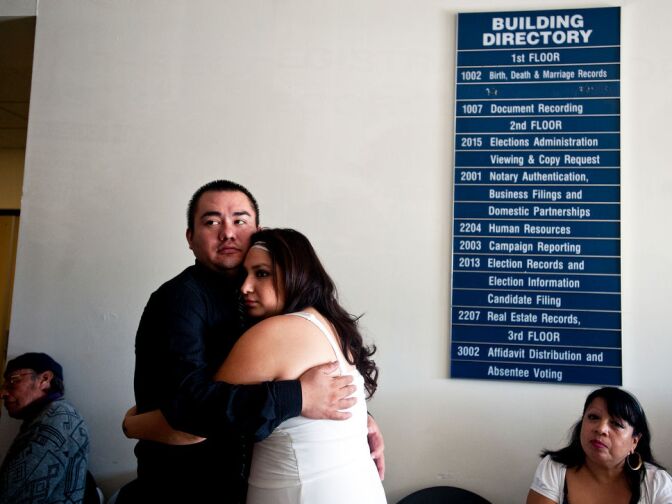 Victor Sanchez and Karina Jara wait with their family before their wedding ceremony. The couple have been together for two years.