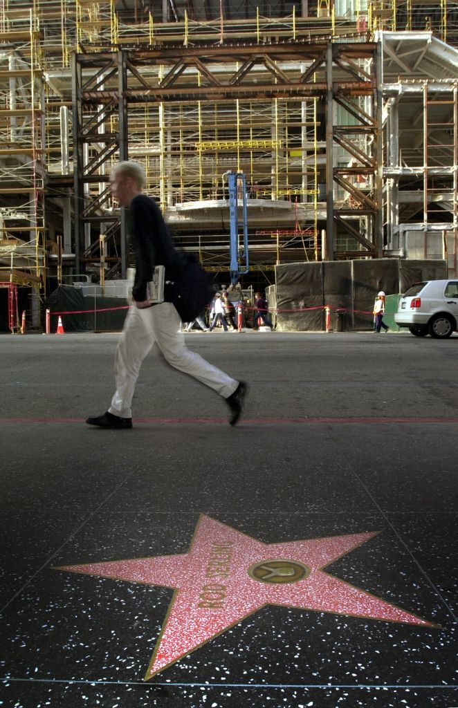 A pedestrian walks next to Rod Serling's star in Hollywood, California.