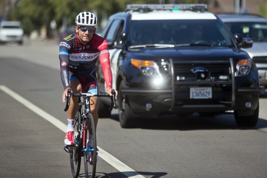 Cyclists and California Highway Patrol officers demonstrate what three feet between cars and bikes looks like. Starting September 16, drivers must give cyclists at least three feet of clearance.