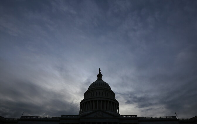The U.S. Capitol is shown at sunset October 15, 2013 in Washington, DC. The U.S. government shutdown is in its fifteenth day as the U.S. Senate and House of Representatives remain gridlocked on funding the federal government and raising the nation's debt limit.  
