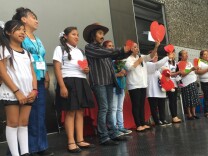 Parents and family members on stage after a performance aimed at finding solutions to violence as part of the Culture of Respect gathering at the California Science Center, Los Angeles, July 30, 2016.