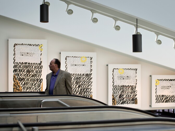 Works by artist ETMCA are on view inside the entrance to terminal 6 at Los Angeles International Airport as part of the “Influx: Art at LAX” exhibition.