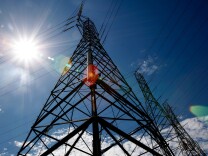 File: The sun shines over towers carrying electrical lines Aug. 30, 2007 in south San Francisco.