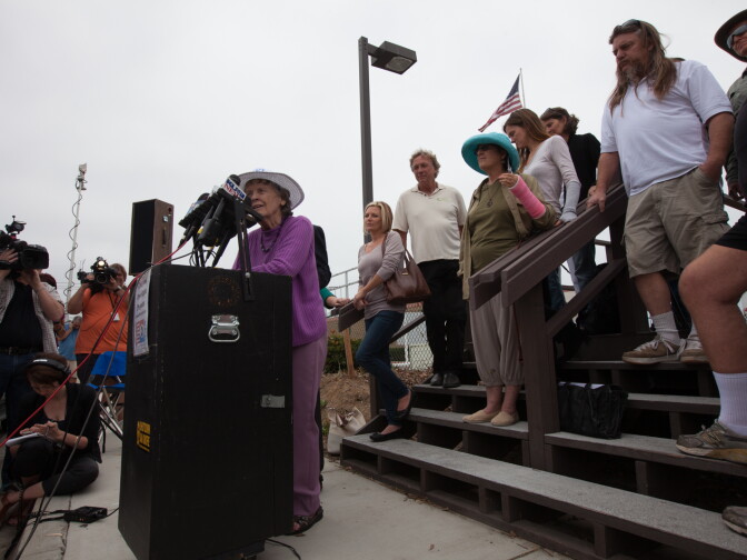 Environmental activists hug at a press conference outside of the San Onofre nuclear plant on June 7th, 2013. Edison announced that the plant will be shut down permanently.