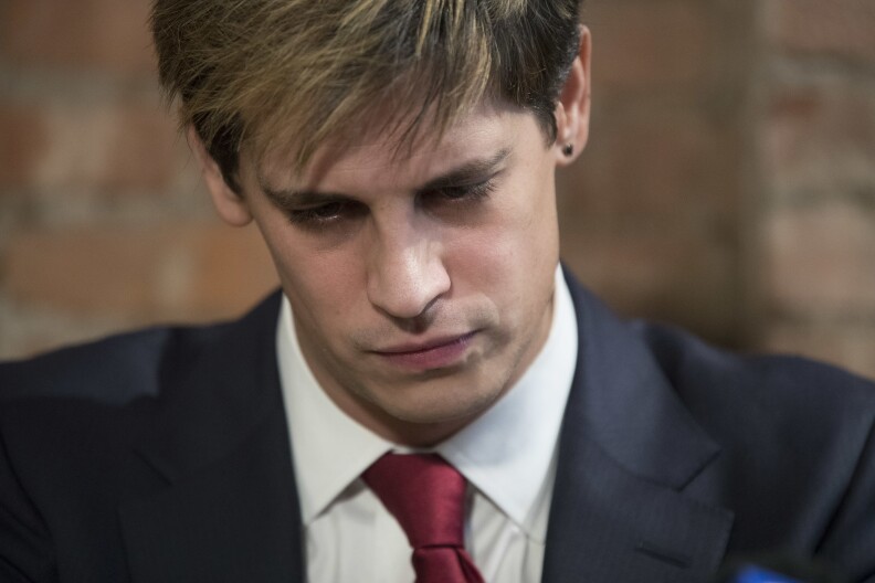 Milo Yiannopoulos speaks during a news conference, Tuesday, Feb. 21, 2017, in New York.  Yiannopoulos has resigned as editor of Breitbart Tech after coming under fire from other conservatives over comments on sexual relationships between boys and older men.  (AP Photo/Mary Altaffer)