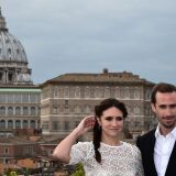 British actor Joseph Fiennes poses with Argentinian actress Maria Botto with the Vatican in the background during a photocall of the movie "Risen" on February 3, 2016 in Rome. The US biblical movie is directed by Kevin Reynolds.   AFP PHOTO / ALBERTO PIZZOLI / AFP / ALBERTO PIZZOLI        (Photo credit should read ALBERTO PIZZOLI/AFP/Getty Images)